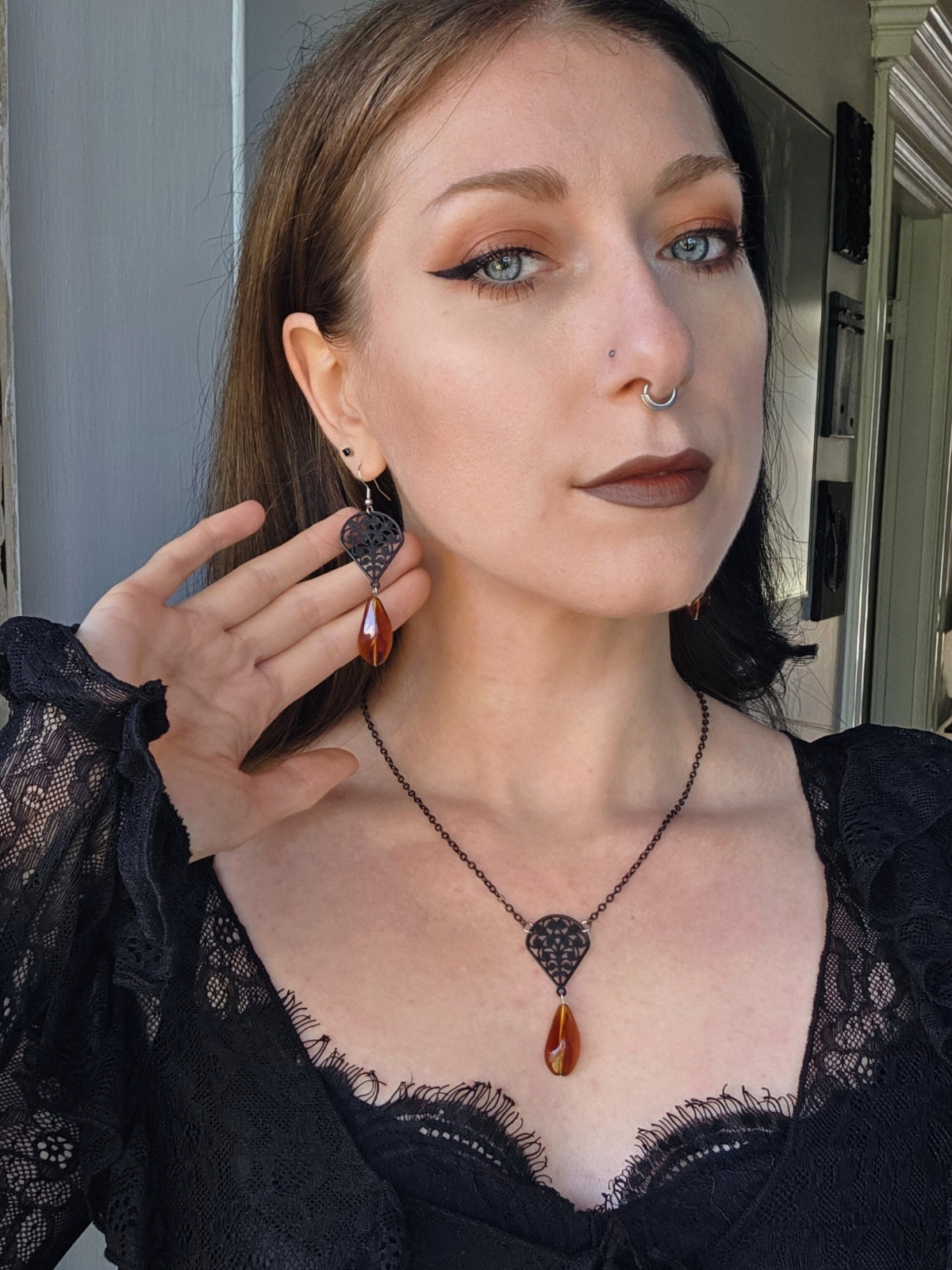 Black filigree orange earrings