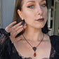 Black filigree orange necklace