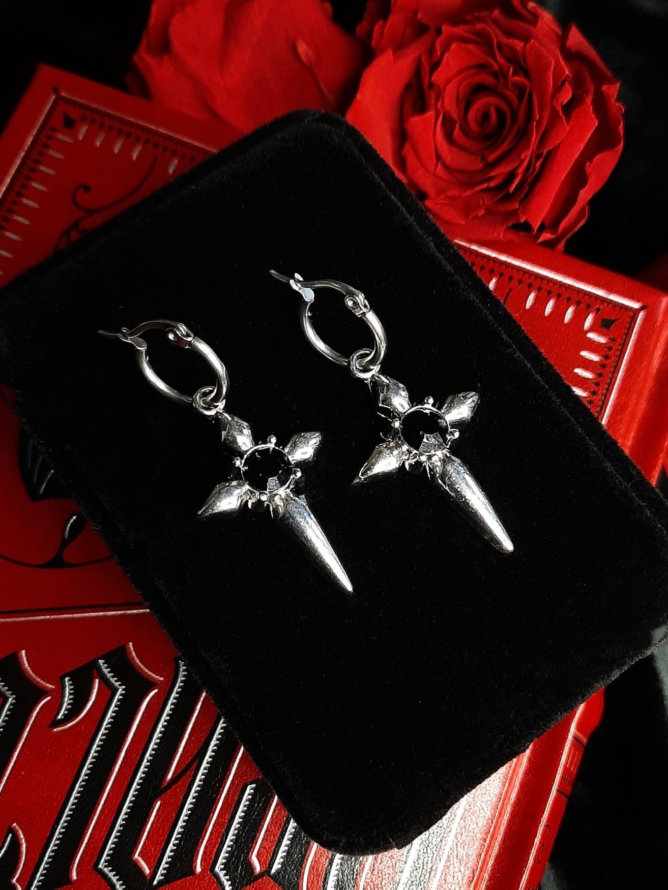 Command cross earrings