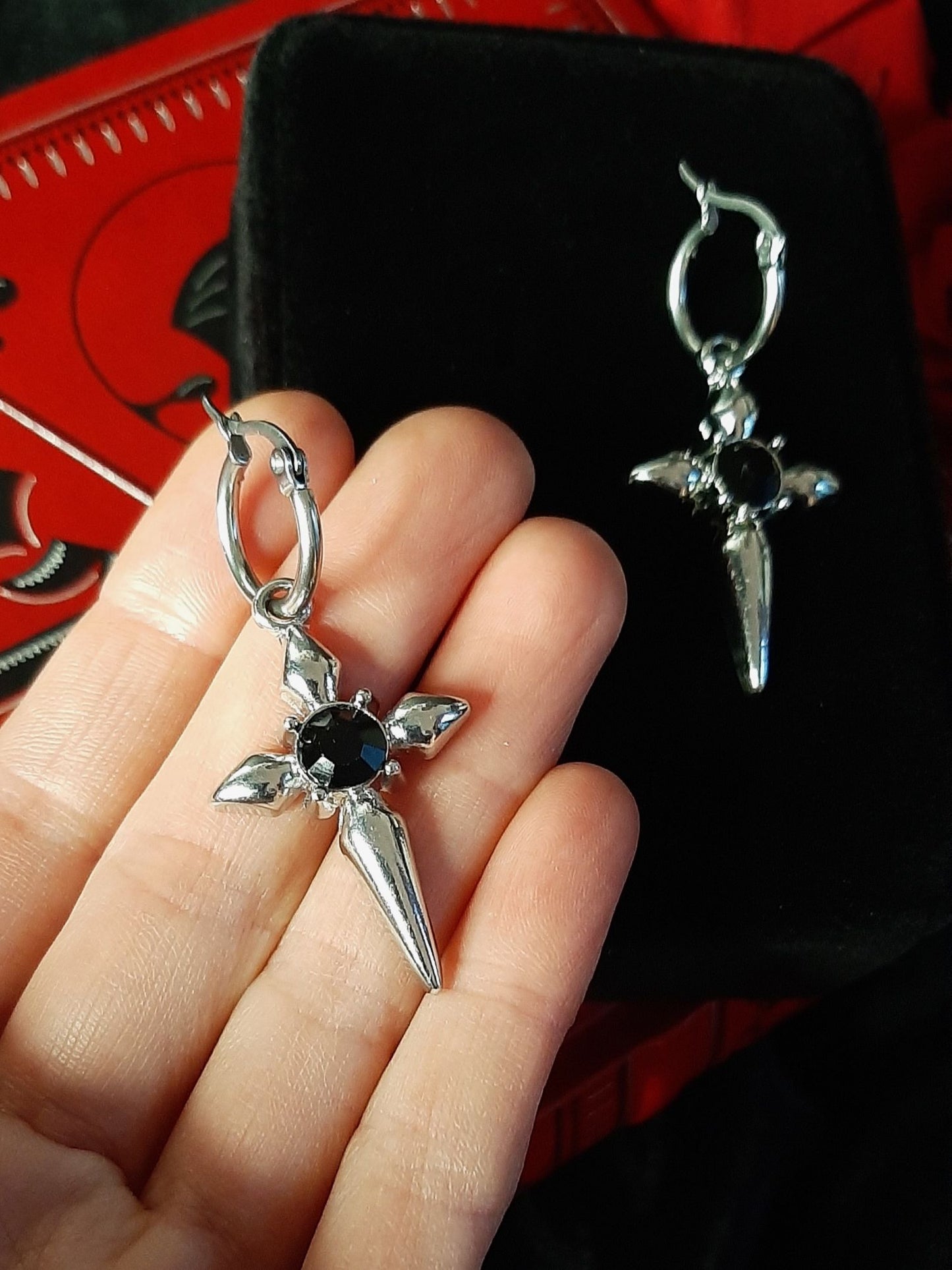 Command cross earrings