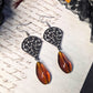 Black filigree orange earrings