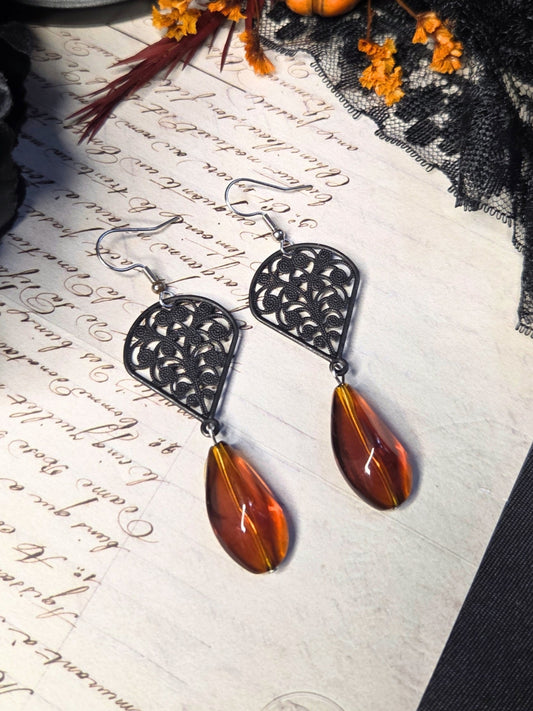 Black filigree orange earrings