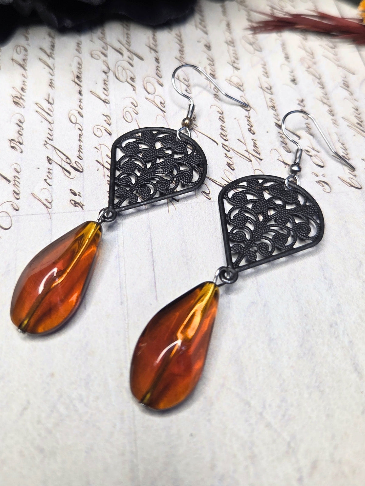 Black filigree orange earrings