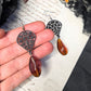 Black filigree orange earrings
