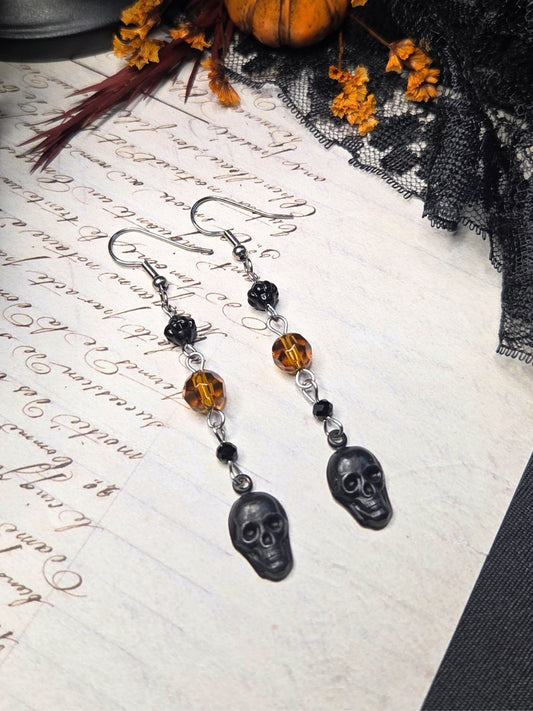 Black skull orange earrings