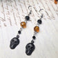 Black skull orange earrings
