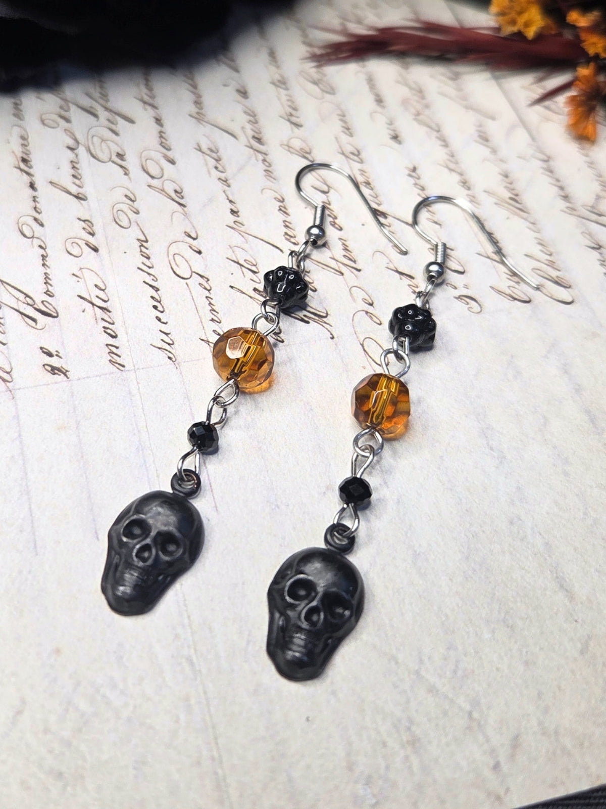 Black skull orange earrings