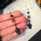 Black skull orange earrings