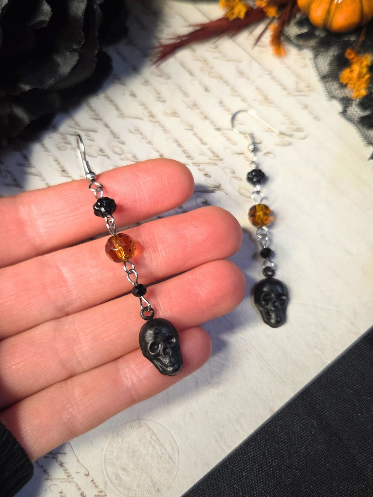 Black skull orange earrings