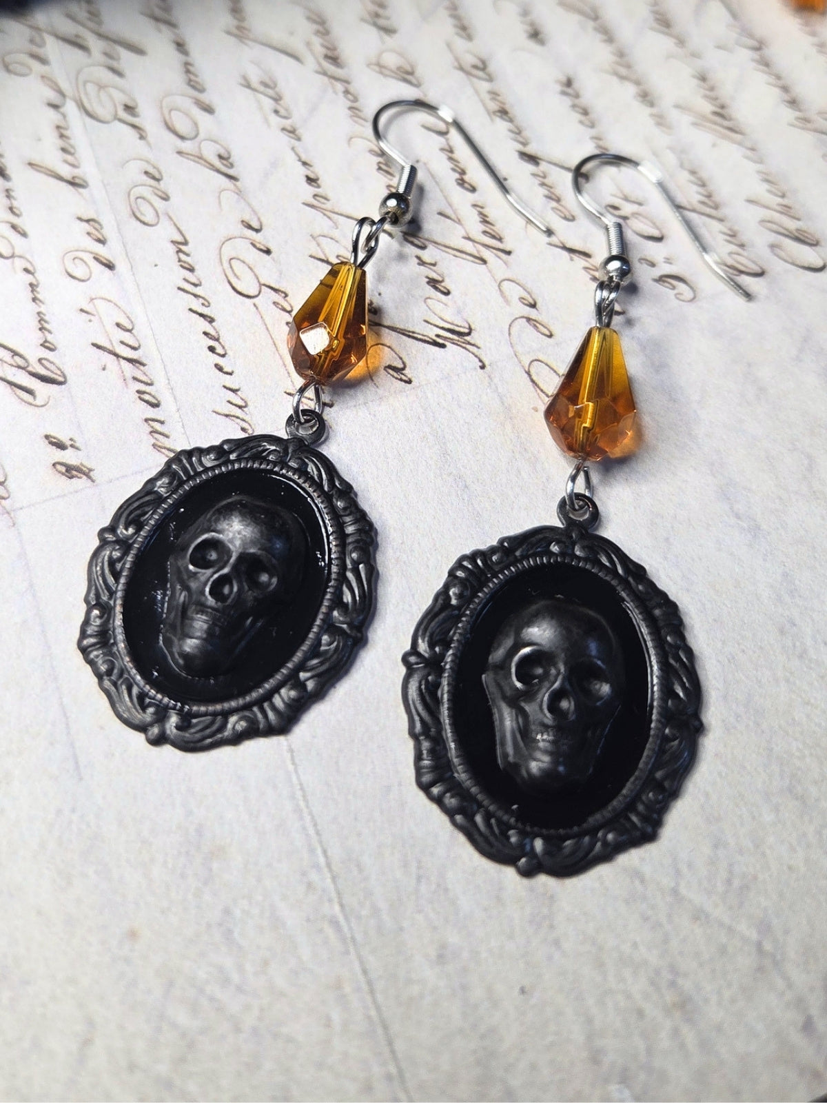 Black skull cameo earrings