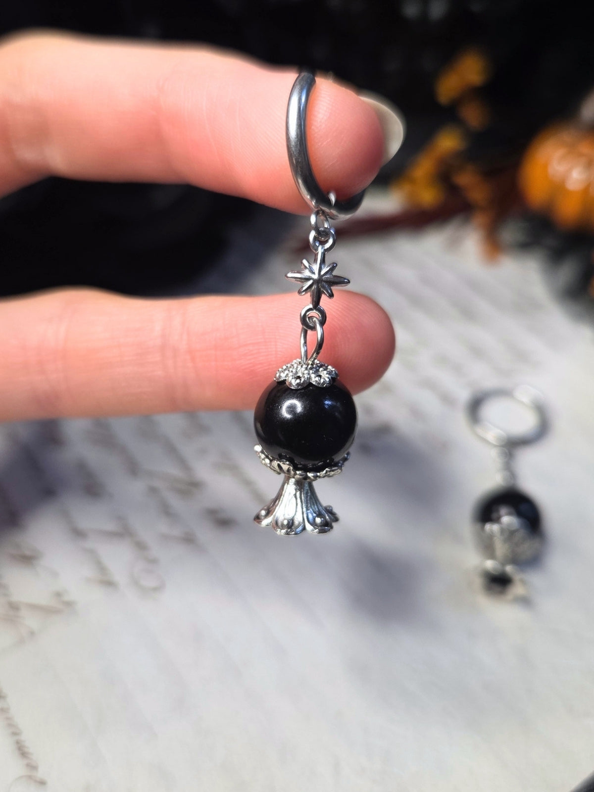 Crystal ball clicker earrings