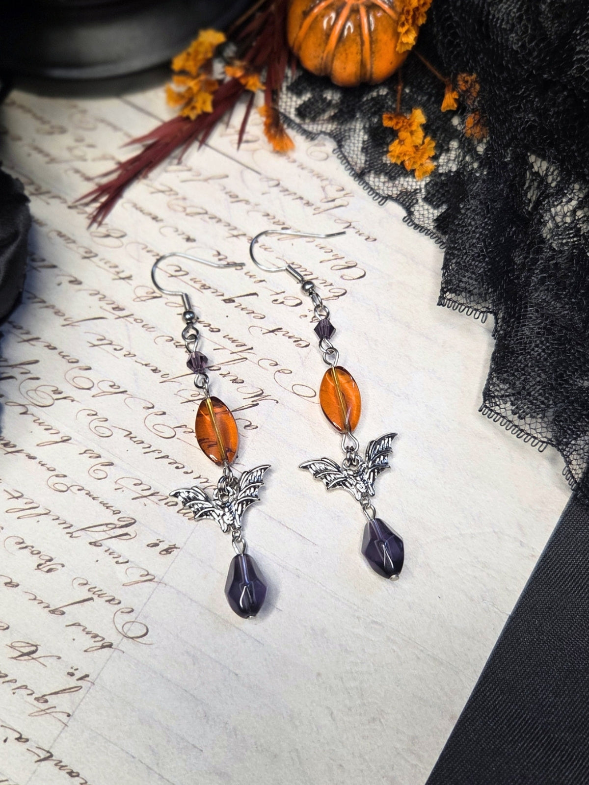Purple orange bat earrings