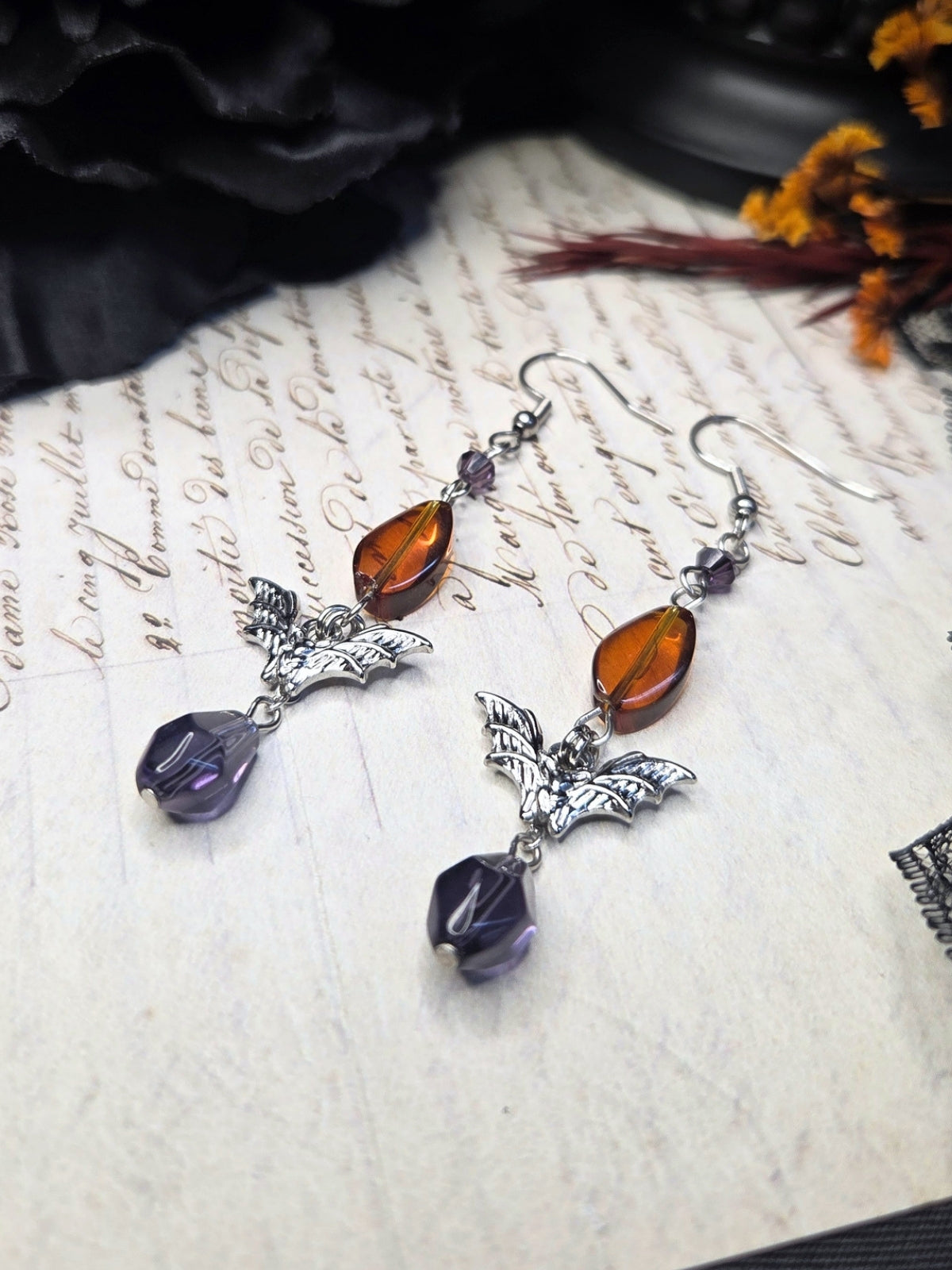 Purple orange bat earrings