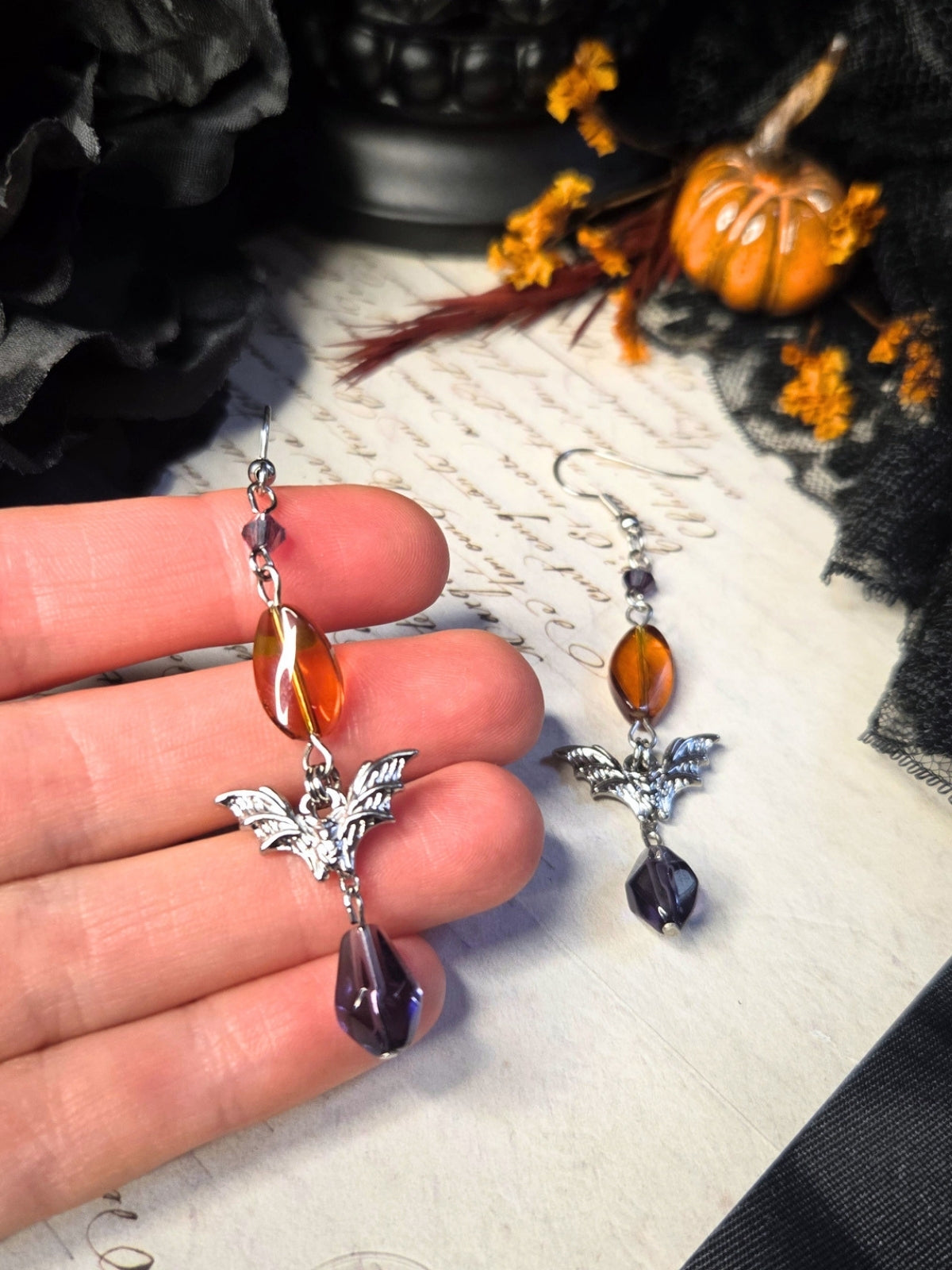 Purple orange bat earrings