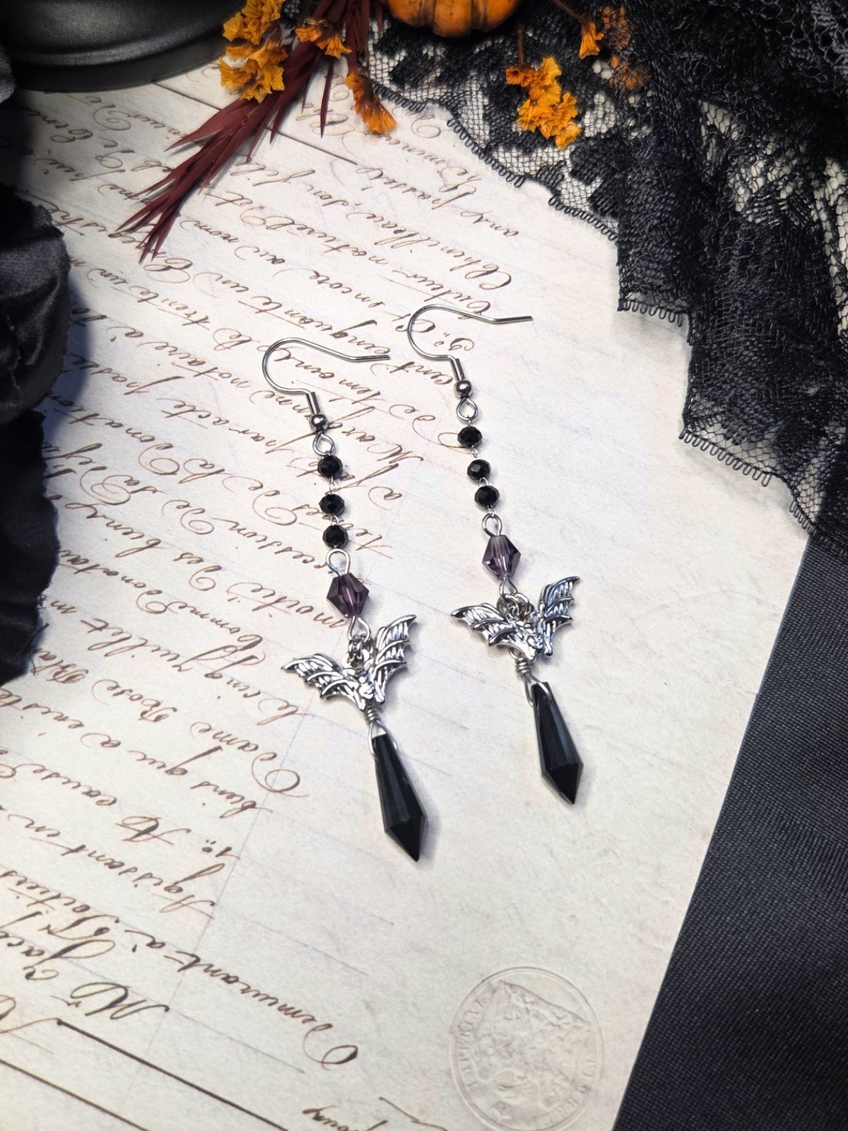 Purple black bat earrings