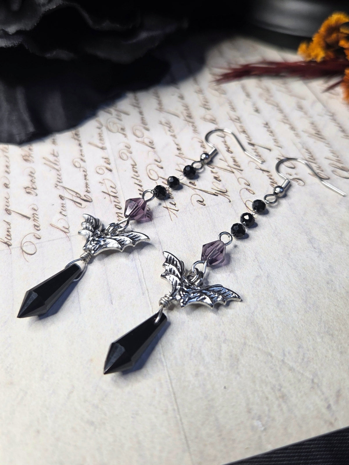 Purple black bat earrings