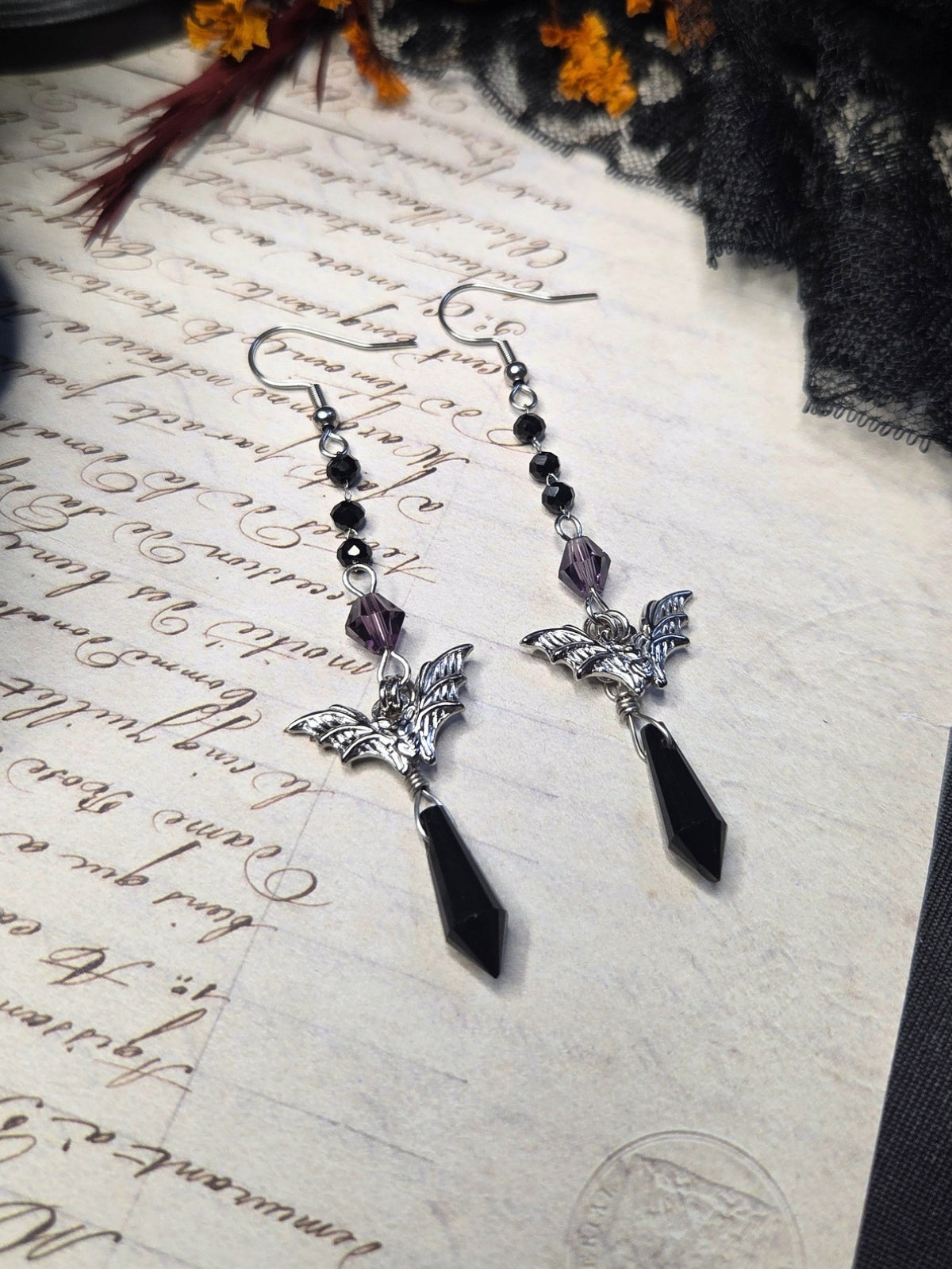 Purple black bat earrings
