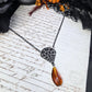 Black filigree orange necklace