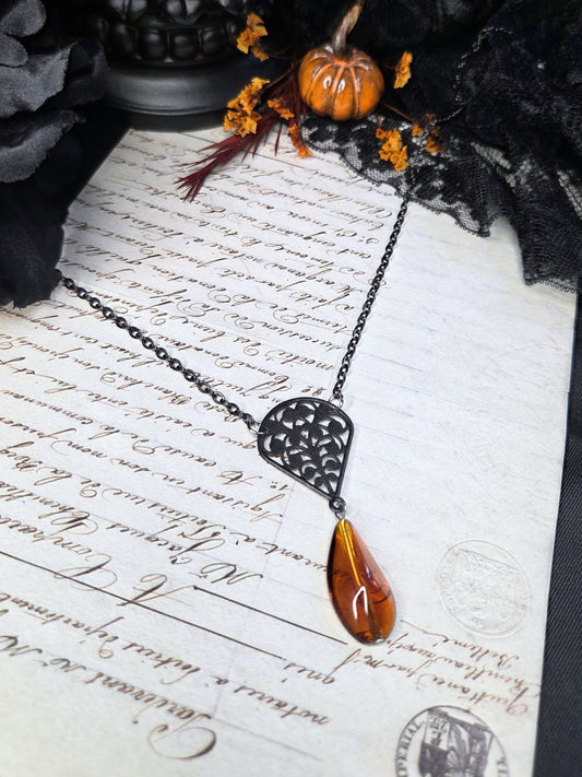 Black filigree orange necklace