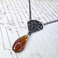 Black filigree orange necklace