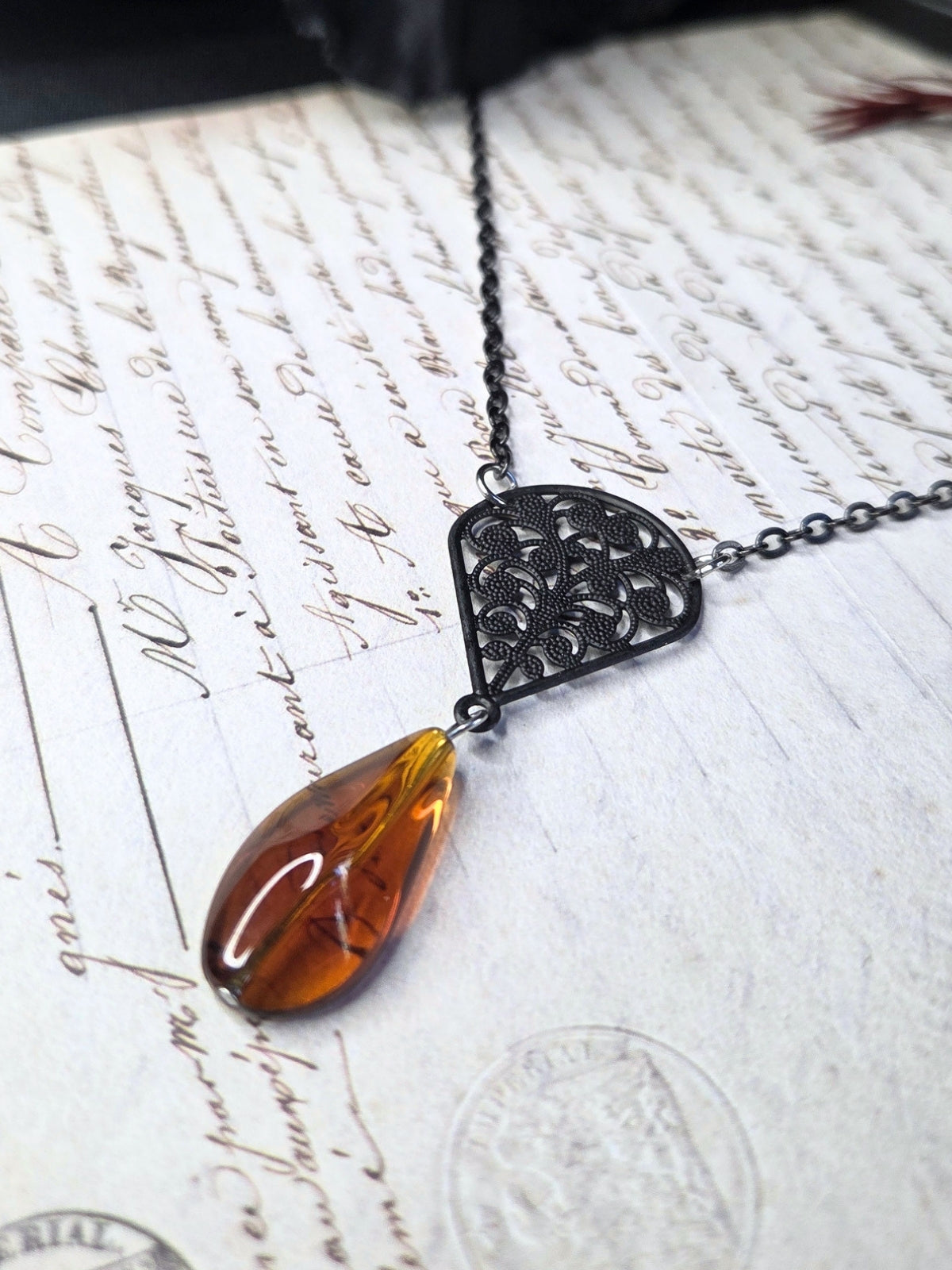Black filigree orange necklace