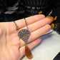 Black filigree orange necklace