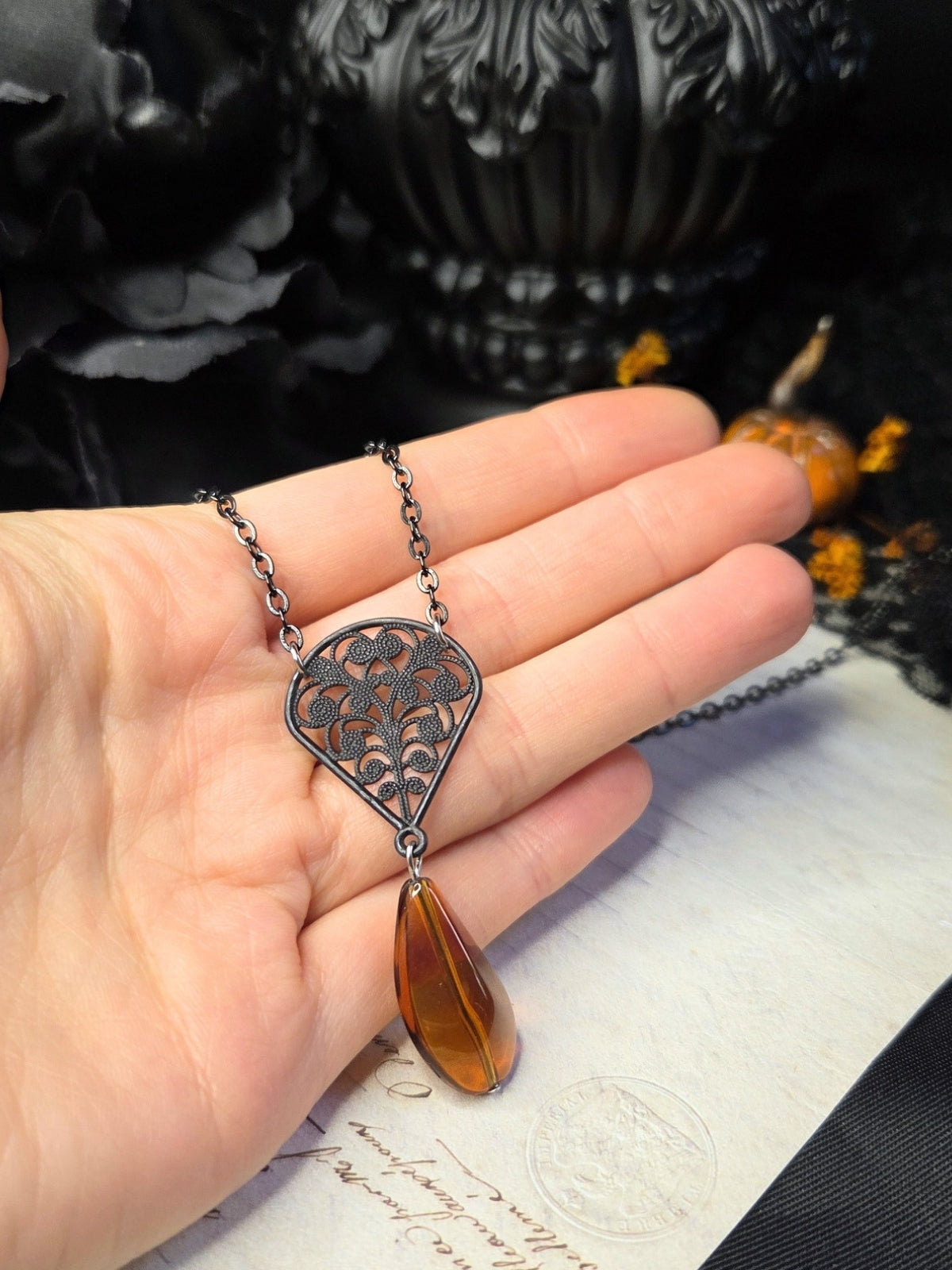Black filigree orange necklace