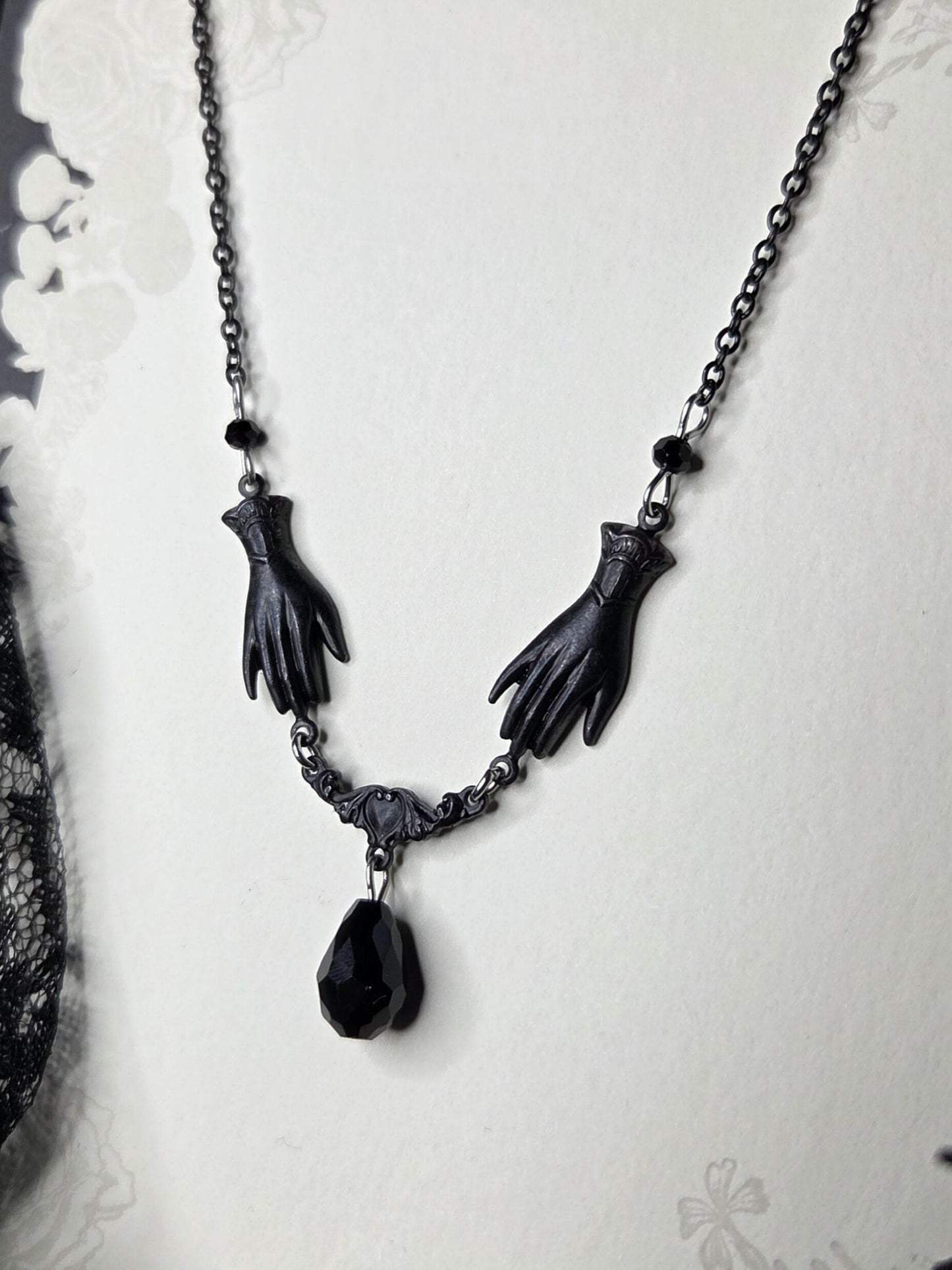 SOLACE mourning hand necklace