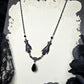 SOLACE mourning hand necklace