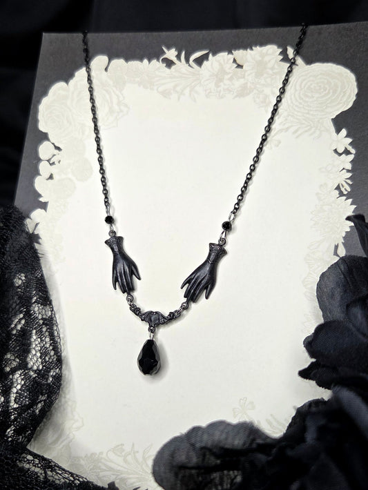 SOLACE mourning hand necklace
