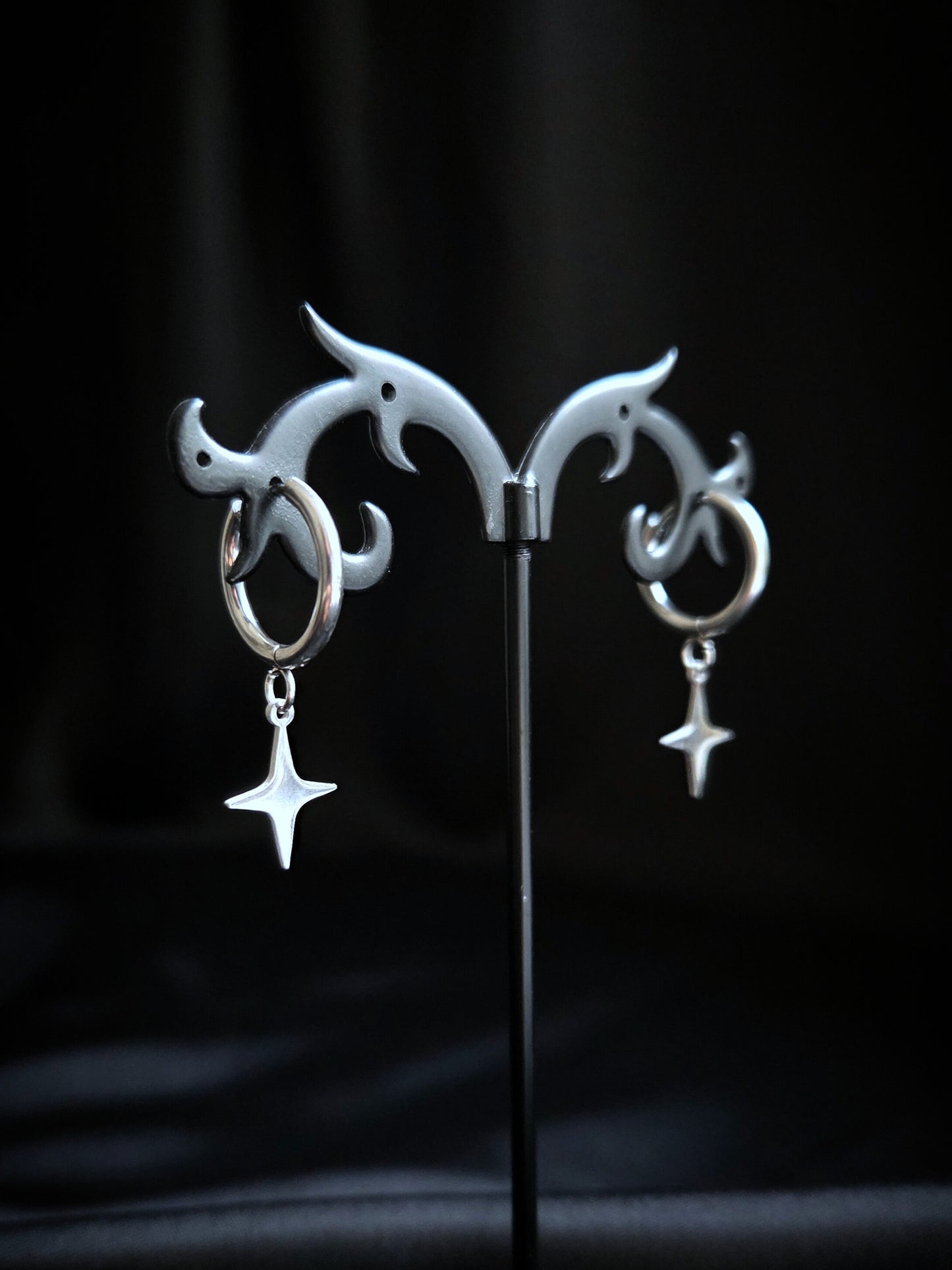 Spark stainless star clicker earrings