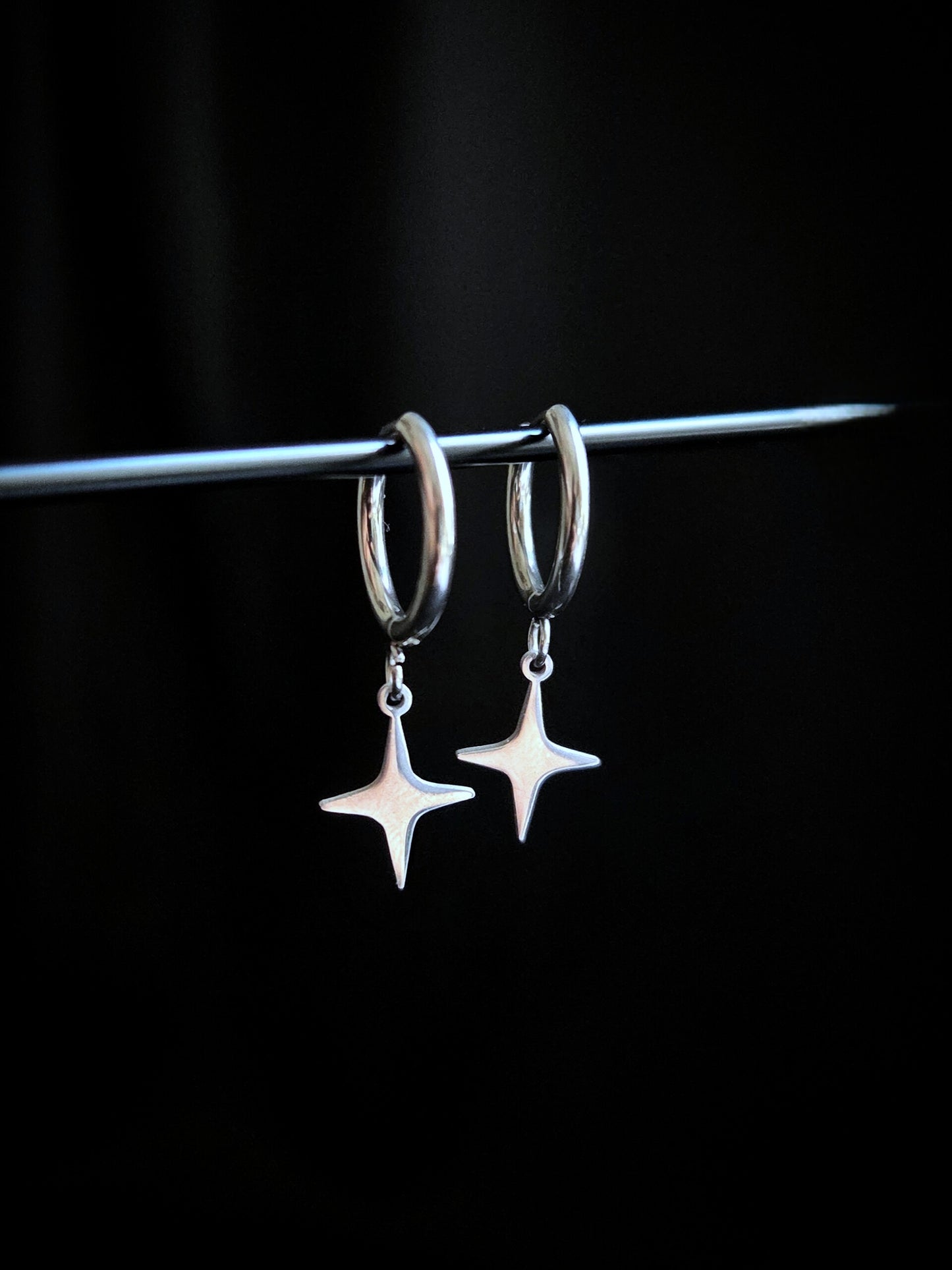 Spark stainless star clicker earrings